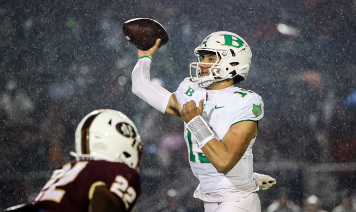 Buford's Dylan Raiola passes over the pass rush of Mill Creek's KingJoseph Edwards. 11/13/2023